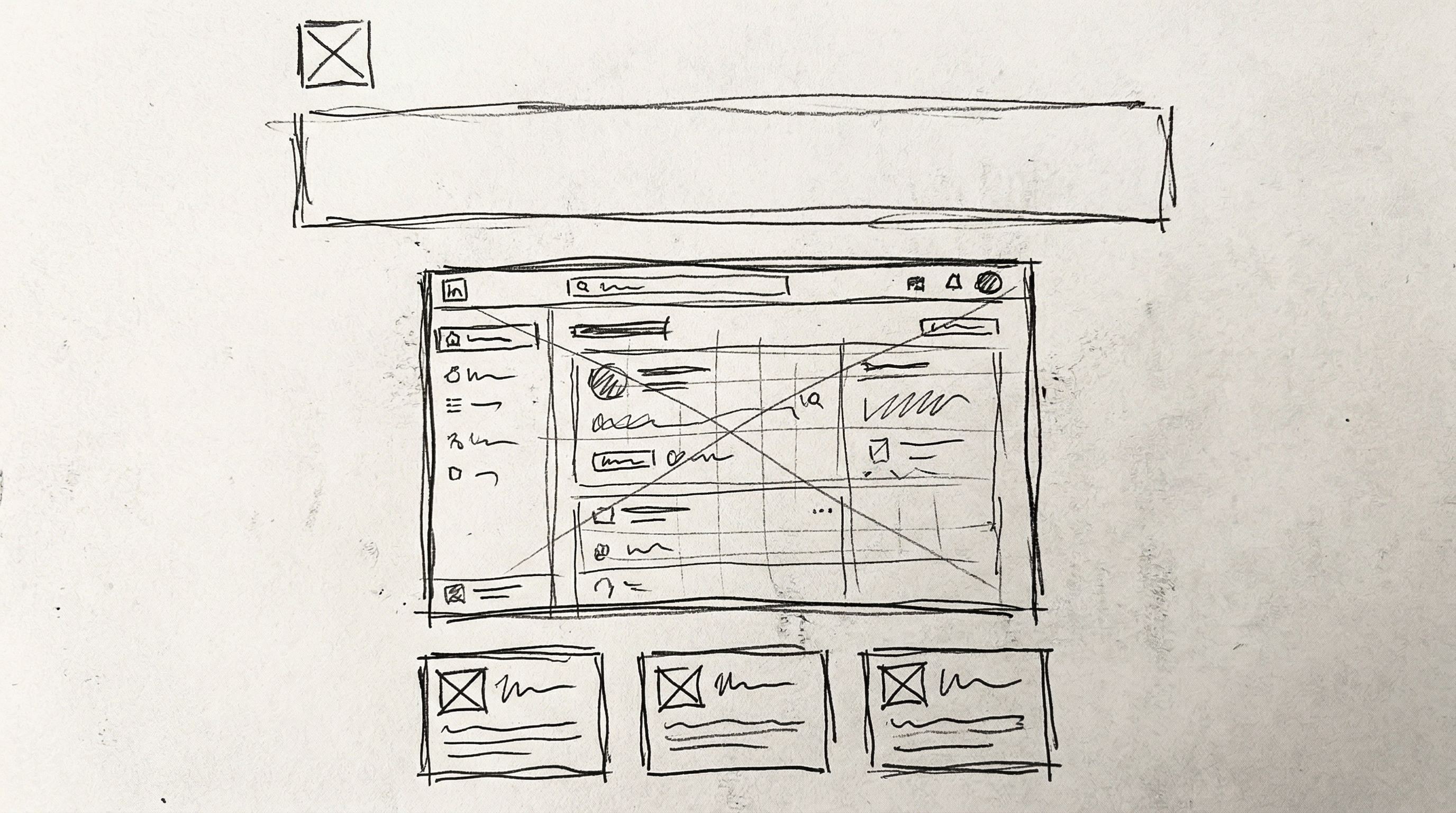 Rough pencil wireframe sketch of a product launch layout — headline bar at top, dashboard UI mockup in center, three feature cards at bottom